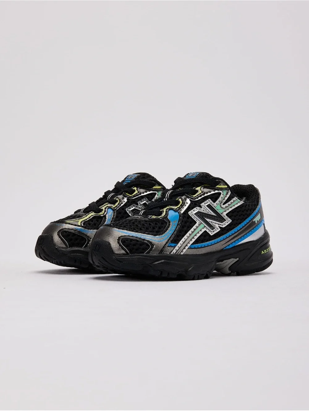 New Balance Kids Black with Blue & Silver Accent Sneakers